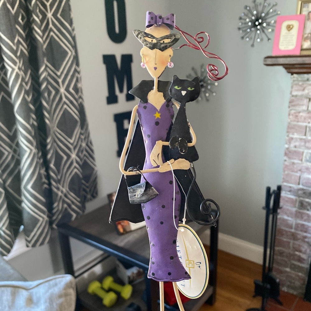 Woman with black cat garden decor